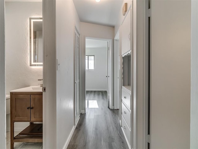 2632 SW 55th St, Oklahoma City, OK 73119 - hallway featuring wood finished floors and baseboards