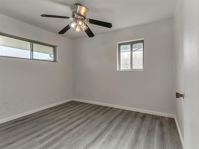 2632 SW 55th St, Oklahoma City, OK 73119 - spare room with wood finished floors and a ceiling fan
