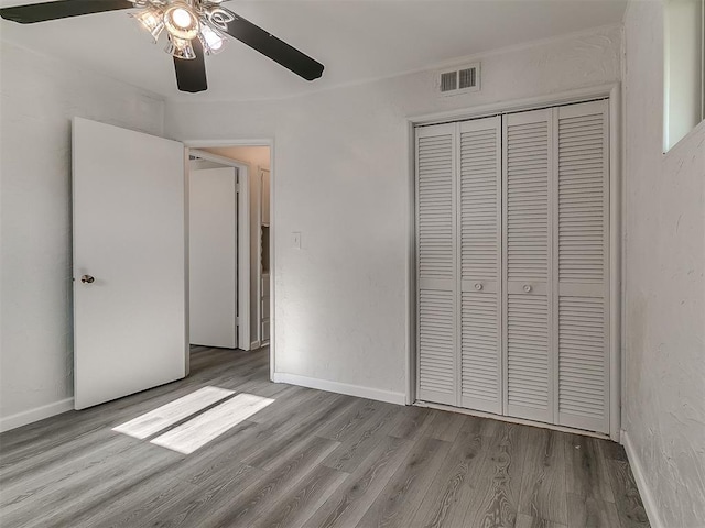 2632 SW 55th St, Oklahoma City, OK 73119 - unfurnished bedroom featuring wood finished floors, a closet, and ceiling fan