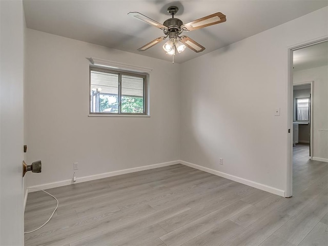 2632 SW 55th St, Oklahoma City, OK 73119 - spare room with a ceiling fan and light wood-style floors