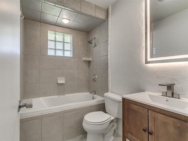 2632 SW 55th St, Oklahoma City, OK 73119 - full bath featuring tiled shower / bath combo, vanity, and a textured wall