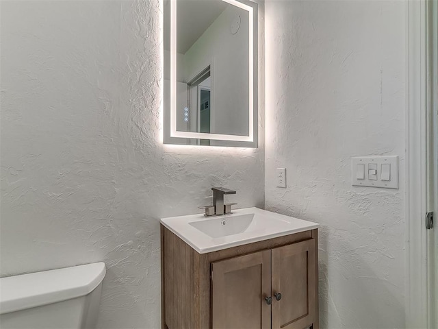 2632 SW 55th St, Oklahoma City, OK 73119 - half bath with vanity and a textured wall