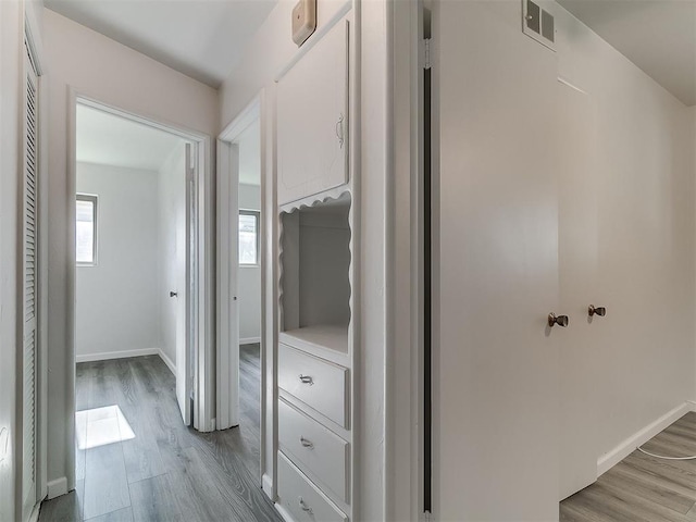 2632 SW 55th St, Oklahoma City, OK 73119 - hall with light wood-style flooring and baseboards