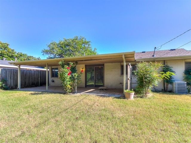 2632 SW 55th St, Oklahoma City, OK 73119 - rear view of house featuring brick siding, a patio, and a carport