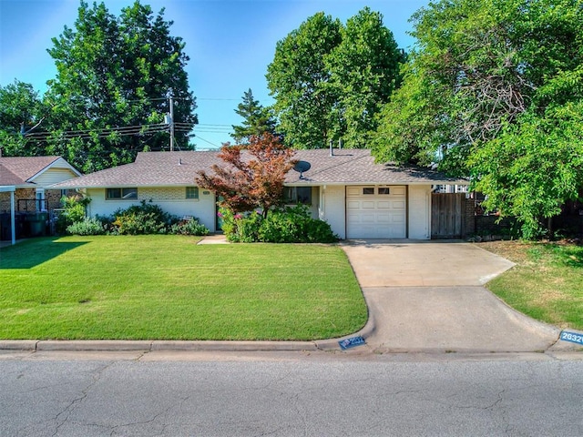 2632 SW 55th St, Oklahoma City, OK 73119 - ranch-style house featuring concrete driveway, an attached garage, and brick siding
