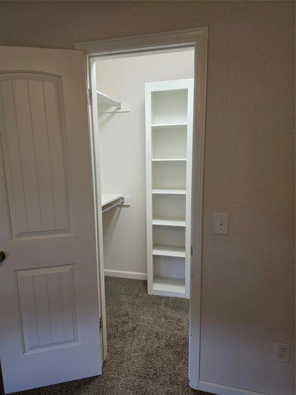 8813 Aaron Dr, Oklahoma City, OK 73132 - spacious closet with carpet