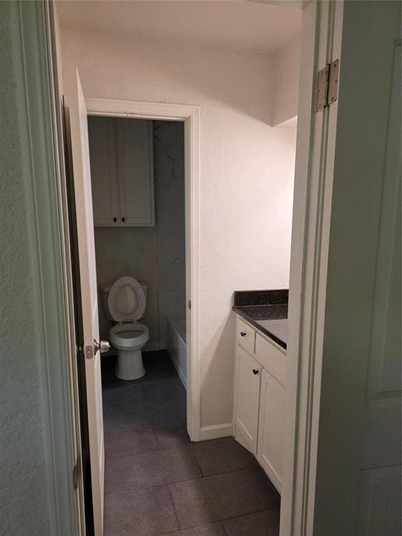 8813 Aaron Dr, Oklahoma City, OK 73132 - bathroom featuring vanity, tile patterned flooring, and a bathtub