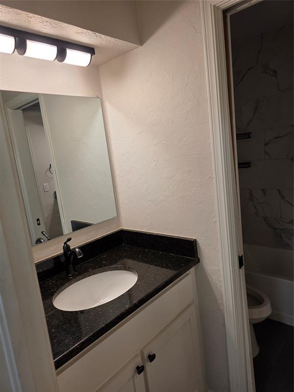 8813 Aaron Dr, Oklahoma City, OK 73132 - bathroom with vanity and toilet