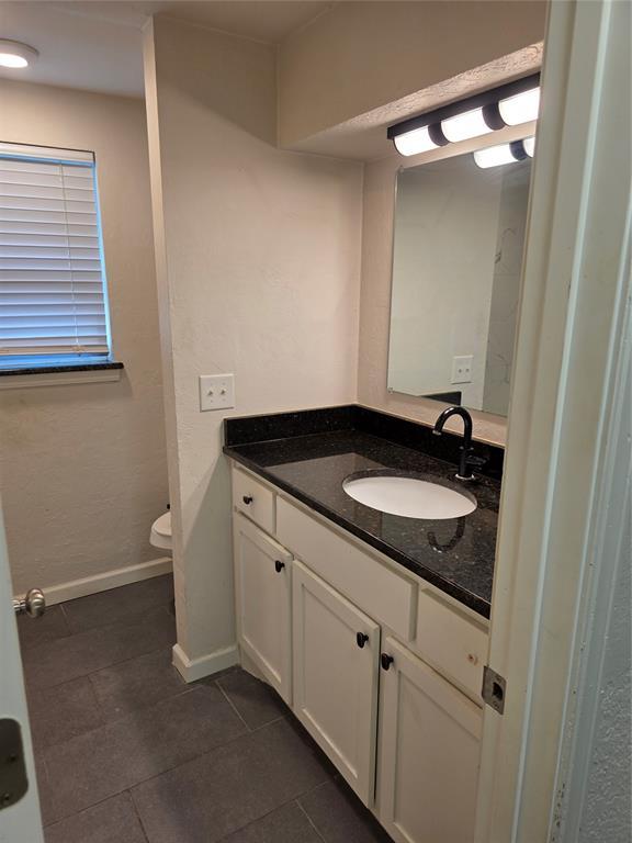 8813 Aaron Dr, Oklahoma City, OK 73132 - bathroom with vanity and tile patterned floors