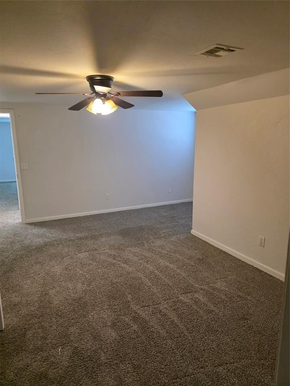 8813 Aaron Dr, Oklahoma City, OK 73132 - unfurnished room featuring dark carpet and a ceiling fan