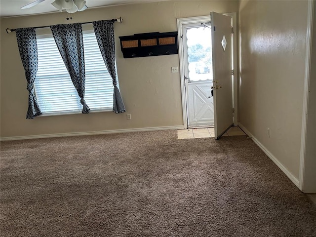 3305 N Mueller Ave, Bethany, OK 73008 - entryway featuring light carpet, plenty of natural light, and ceiling fan