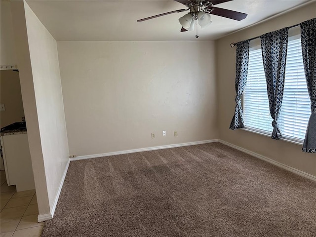 3305 N Mueller Ave, Bethany, OK 73008 - empty room featuring a ceiling fan and light colored carpet