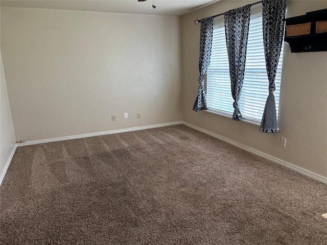 3305 N Mueller Ave, Bethany, OK 73008 - carpeted spare room featuring baseboards and ceiling fan