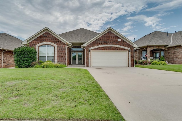 1308 River Birch Dr, Yukon, OK 73099 - single story home with an attached garage, brick siding, a front yard, driveway, and a shingled roof