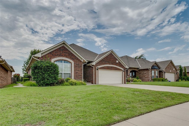 1308 River Birch Dr, Yukon, OK 73099 - ranch-style home featuring an attached garage, brick siding, a front lawn, and concrete driveway