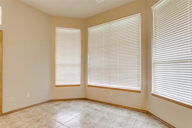 1308 River Birch Dr, Yukon, OK 73099 - unfurnished room with light tile patterned floors and baseboards