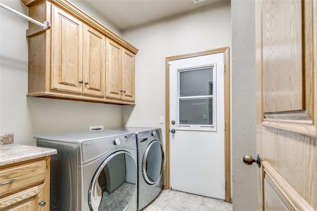 1308 River Birch Dr, Yukon, OK 73099 - laundry room with cabinet space, washer and dryer, and light tile patterned floors