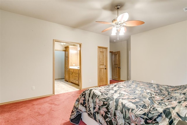 1308 River Birch Dr, Yukon, OK 73099 - bedroom with light carpet, ceiling fan, and ensuite bathroom