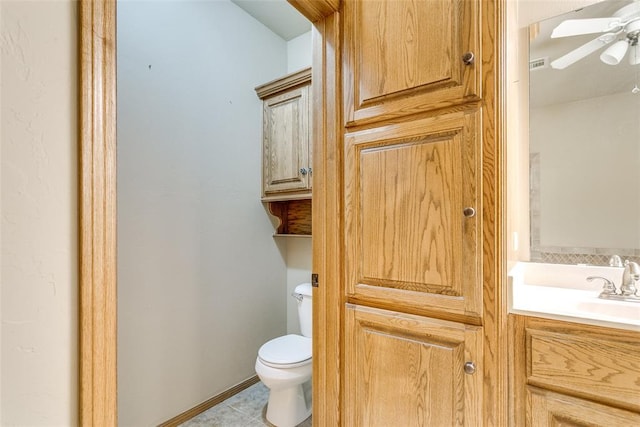 1308 River Birch Dr, Yukon, OK 73099 - half bath with vanity, a ceiling fan, and tile patterned flooring