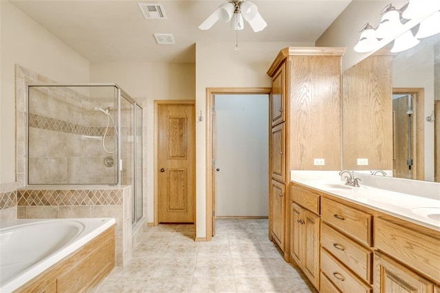 1308 River Birch Dr, Yukon, OK 73099 - bathroom featuring a garden tub, a stall shower, double vanity, a ceiling fan, and tile patterned flooring