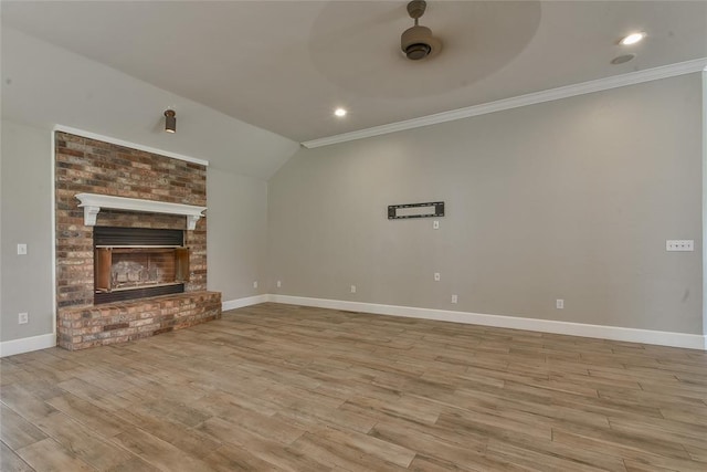 3019 Winding Creek Ln, Piedmont, OK 73078 - unfurnished living room featuring wood finished floors, crown molding, vaulted ceiling, a fireplace, and recessed lighting