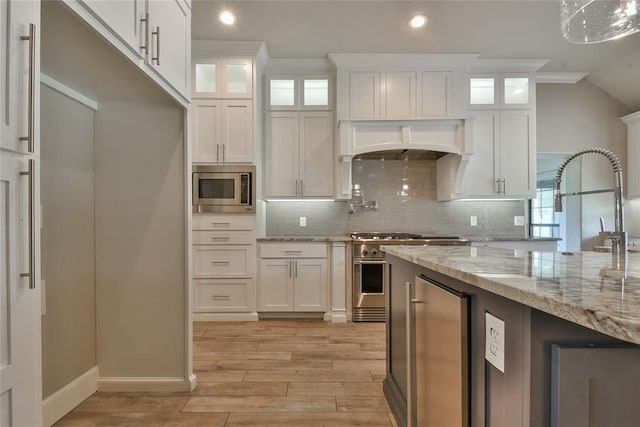 3019 Winding Creek Ln, Piedmont, OK 73078 - kitchen featuring stainless steel appliances, white cabinetry, light wood-style floors, backsplash, and recessed lighting