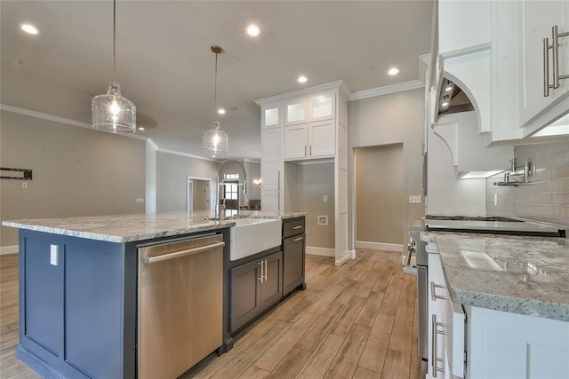 3019 Winding Creek Ln, Piedmont, OK 73078 - kitchen with appliances with stainless steel finishes, crown molding, light wood-style flooring, white cabinetry, and tasteful backsplash