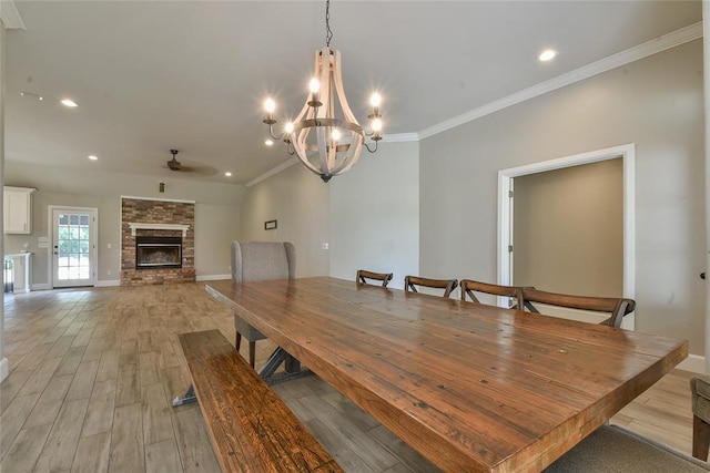 3019 Winding Creek Ln, Piedmont, OK 73078 - dining area with a ceiling fan, light wood-style floors, a fireplace, ornamental molding, and recessed lighting
