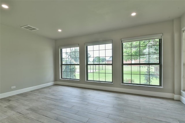 3019 Winding Creek Ln, Piedmont, OK 73078 - unfurnished room with healthy amount of natural light, light wood-type flooring, and recessed lighting