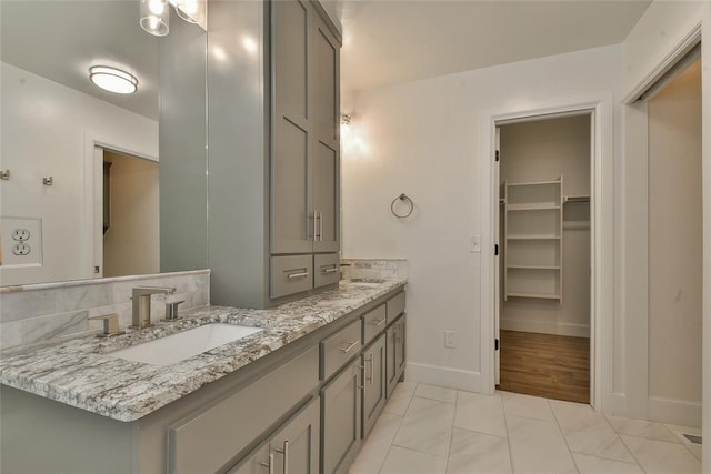 3019 Winding Creek Ln, Piedmont, OK 73078 - bathroom featuring double vanity, marble finish floors, and a walk in closet