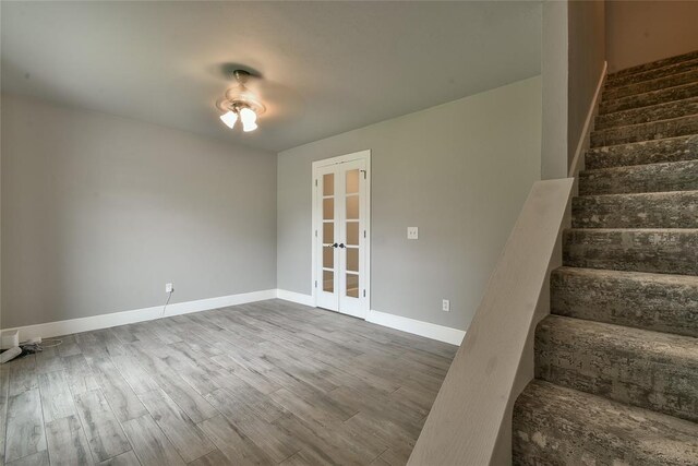 3019 Winding Creek Ln, Piedmont, OK 73078 - stairway with french doors and wood finished floors