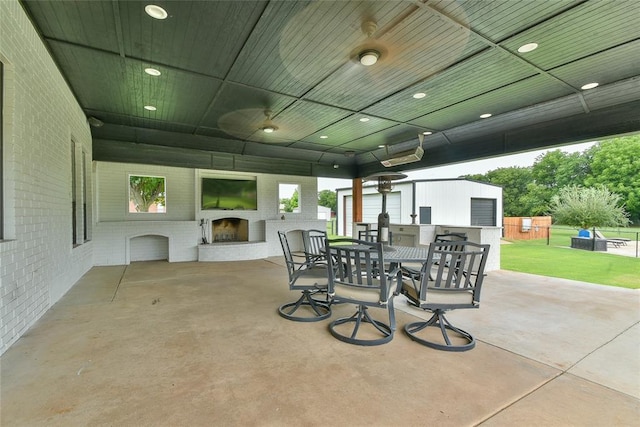 3019 Winding Creek Ln, Piedmont, OK 73078 - view of patio featuring an outdoor fireplace, outdoor dining space, and ceiling fan