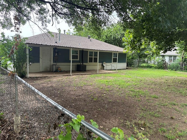 3307 N Mueller Ave, Bethany, OK 73008 - rear view of property with a patio, a fenced backyard, and roof with shingles
