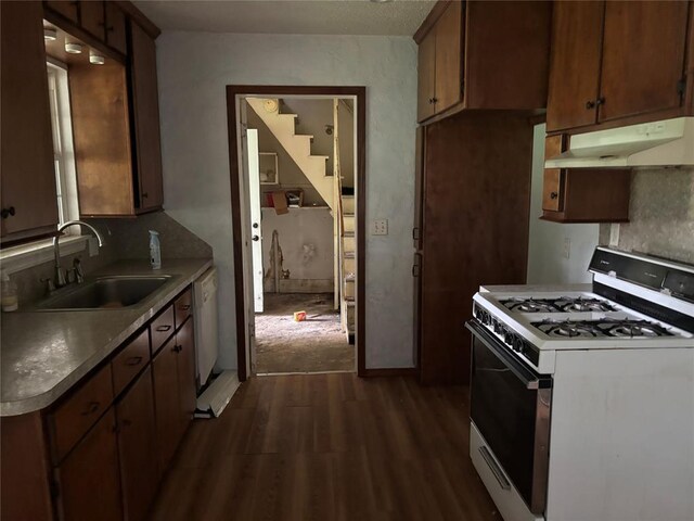 3307 N Mueller Ave, Bethany, OK 73008 - kitchen with white appliances, under cabinet range hood, and dark wood-type flooring