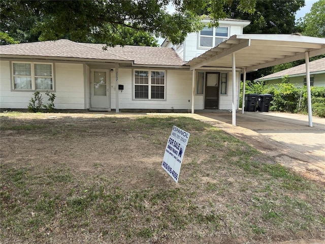 3307 N Mueller Ave, Bethany, OK 73008 - view of front of house with roof with shingles, concrete driveway, and an attached carport