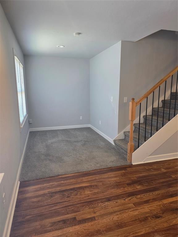 6101 NW 48th St, Warr Acres, OK 73122 - unfurnished room featuring wood finished floors and stairway
