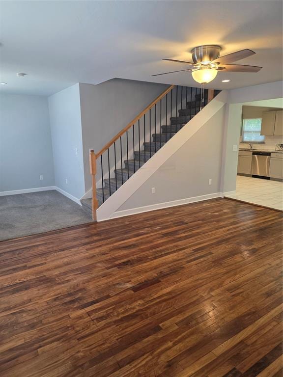 6101 NW 48th St, Warr Acres, OK 73122 - unfurnished living room featuring stairway, wood finished floors, and ceiling fan