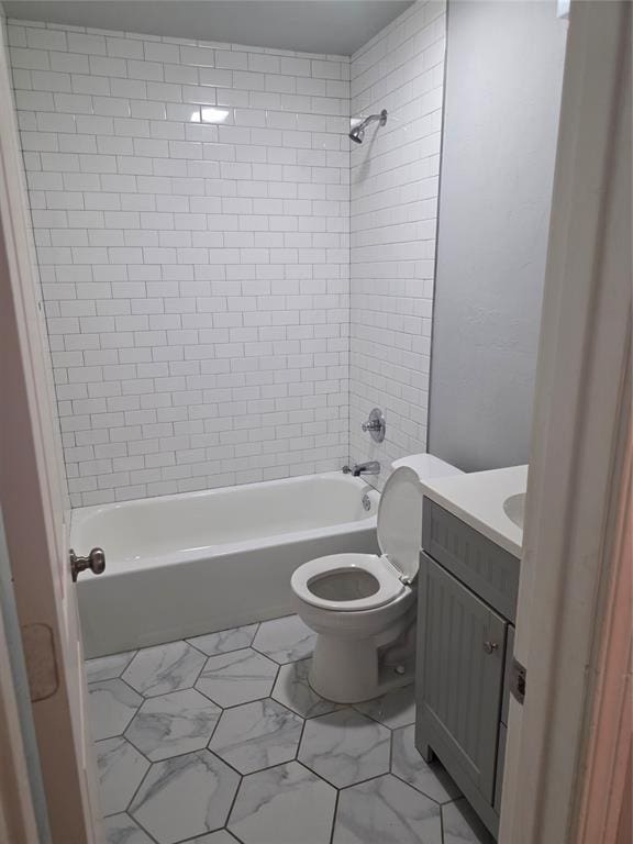 6101 NW 48th St, Warr Acres, OK 73122 - bathroom with vanity, tub / shower combination, and marble look tiles
