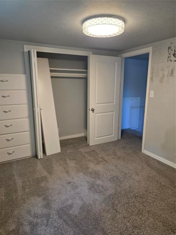 6101 NW 48th St, Warr Acres, OK 73122 - unfurnished bedroom with carpet, a closet, and a textured ceiling