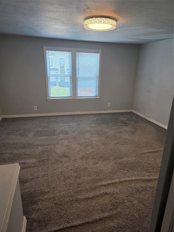 6101 NW 48th St, Warr Acres, OK 73122 - carpeted empty room with baseboards