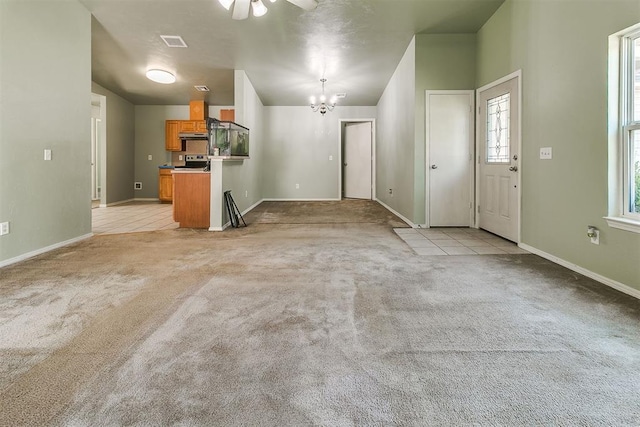 1709 NW 147th St, Edmond, OK 73013 - unfurnished living room featuring a chandelier, light carpet, a ceiling fan, and light tile patterned floors