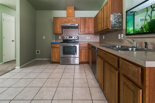1709 NW 147th St, Edmond, OK 73013 - kitchen featuring stainless steel appliances, ventilation hood, brown cabinetry, backsplash, and light tile patterned floors