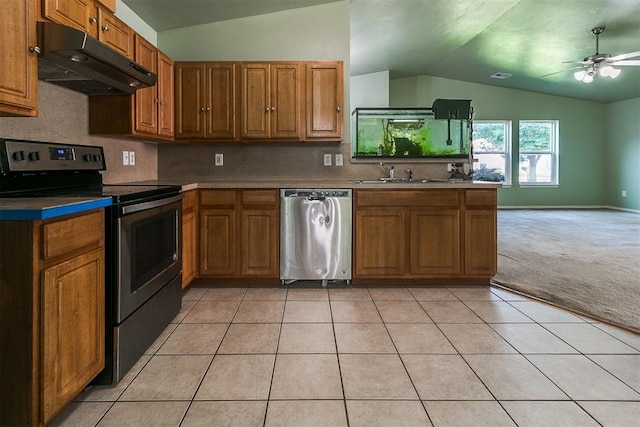 1709 NW 147th St, Edmond, OK 73013 - kitchen with appliances with stainless steel finishes, ventilation hood, lofted ceiling, brown cabinetry, and ceiling fan