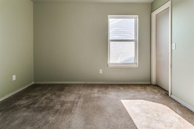 1709 NW 147th St, Edmond, OK 73013 - empty room with dark colored carpet and baseboards