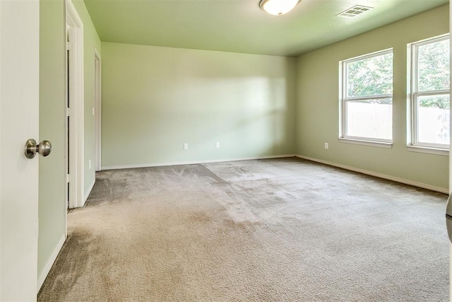 1709 NW 147th St, Edmond, OK 73013 - spare room featuring healthy amount of natural light and carpet flooring