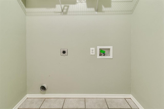 1709 NW 147th St, Edmond, OK 73013 - laundry area with electric dryer hookup, light tile patterned floors, and washer hookup