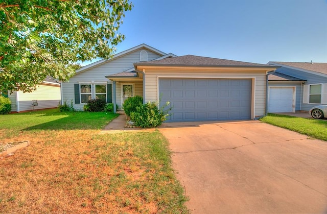 1709 NW 147th St, Edmond, OK 73013 - single story home with an attached garage, driveway, and a front lawn