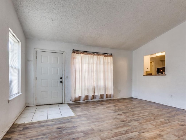 218 Windsor Way, Midwest City, OK 73110 - entrance foyer with a textured ceiling and wood finished floors