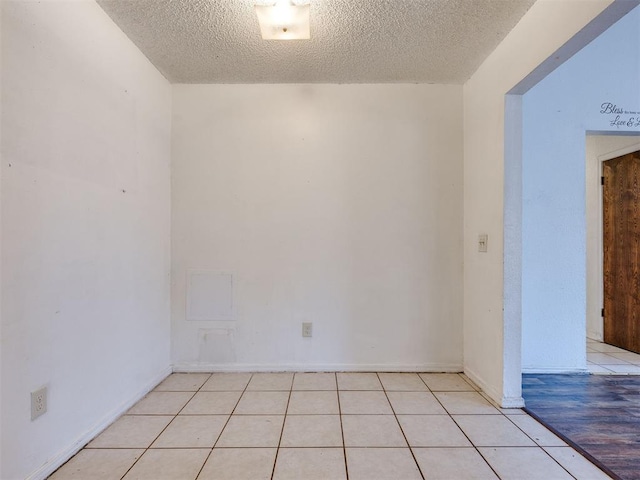 218 Windsor Way, Midwest City, OK 73110 - unfurnished room with a textured ceiling and light tile patterned floors