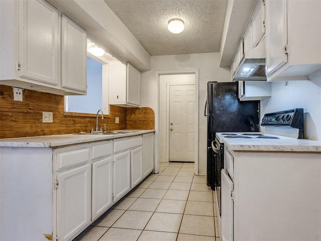 218 Windsor Way, Midwest City, OK 73110 - kitchen with white cabinetry, a textured ceiling, light countertops, light tile patterned floors, and white electric stove